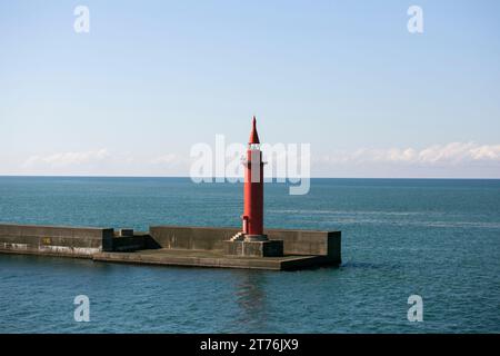 Red lighthouse in the port of Niigata on the northern coast of Japan. Stock Photo