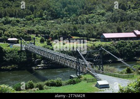 historic swing bridge over Grey river at Brunner Coal Mine, West Coast, New Zealand Stock Photo