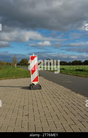 A construction site traffic sign stands on the roadside in Berlin ...