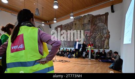 Jena, Germany. 14th Nov, 2023. Public service employees meet in the historic town hall for an information event before the rally on the market square. The trade union Verdi has called for an all-day warning strike throughout Germany as part of the collective bargaining in the public sector of the federal states. Among others, the University Hospital Jena, the University of Jena, the Ernst Abbe Jena University of Applied Sciences and the Studierendenwerk Thüringen will be on strike. Credit: Martin Schutt/dpa/Alamy Live News Stock Photo