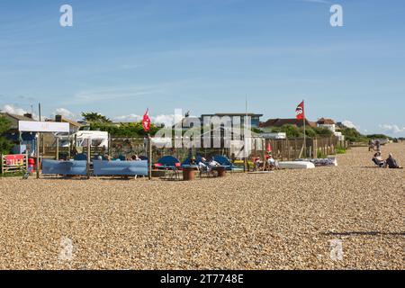 Small beach cafe at East Preston near Littlehampton in West Sussex, l England. With people sitting in sunshine. Stock Photo