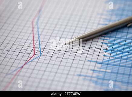 Silver pen lies on paper documents with color Stock Photo