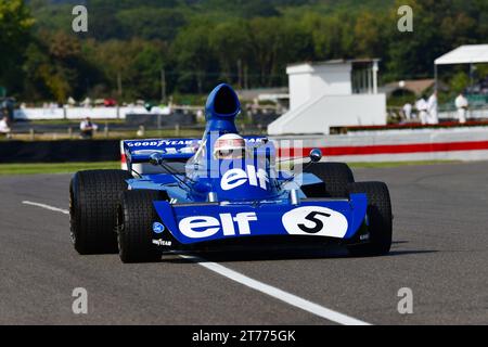 Jackie Stewart, Tyrrell-Cosworth 006, Sir Jackie Stewart Celebration, Sir Jackie driving the Tyrrell-Cosworth 006 in which he won the 1973 Formula One Stock Photo