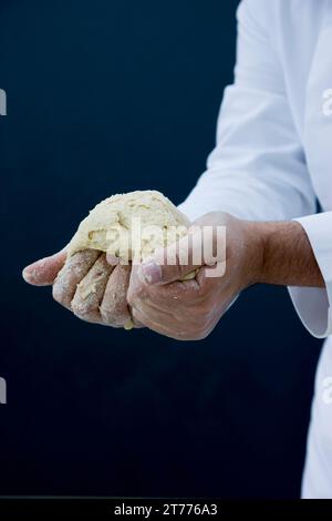 Close up of a chef hands kneading pizza dough Stock Photo