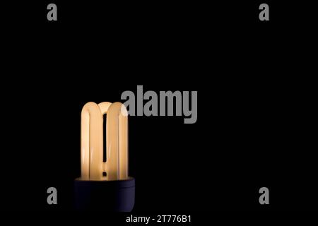 Illuminated energy efficient light bulb Stock Photo