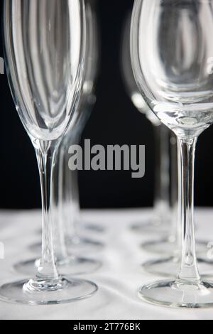 Close up of empty wine glasses lined up on a table Stock Photo