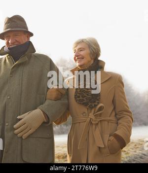 Portrait of a mature couple walking in the park Stock Photo