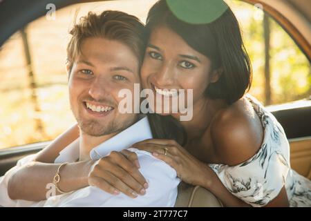 Portrait of Smiling Couple inside Car Stock Photo