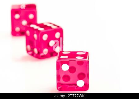 three pink dices on white background Stock Photo