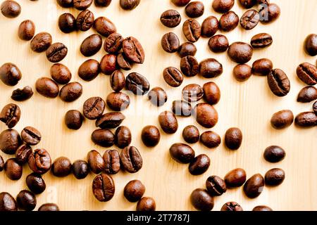 a lot of coffee beans over wood background Stock Photo