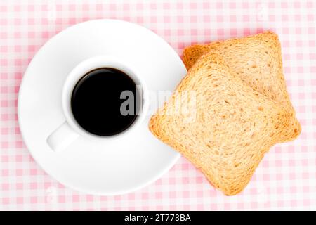coffee and toasts on table with tablecloth Stock Photo