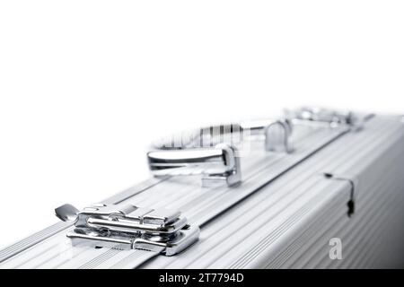 detail of one aluminum suitcase isolated on a white background Stock Photo