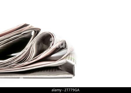 stack of financial newspapers with space for text on white background Stock Photo