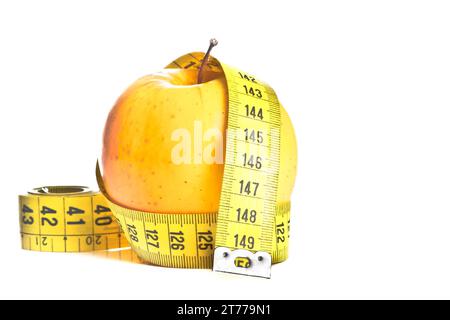 measuring tape around apple on white background Stock Photo