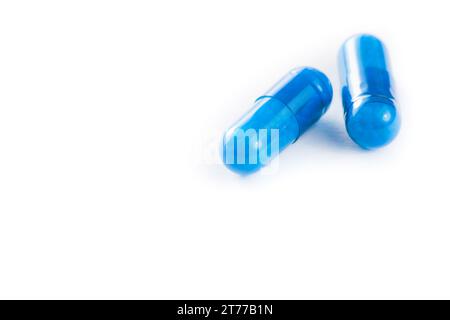 two blue pills isolated on white background with space for text Stock Photo