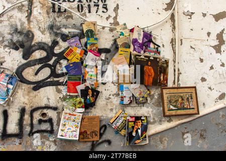 Old books and magazines on the wall in the flea market in Algiers City. Stock Photo