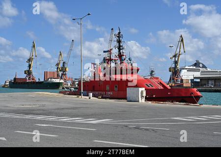 Red fireboat designed for firefighting and fire extinguishing of vessels and port infrastructure is moored in passenger terminal of seaport Heraklion Stock Photo