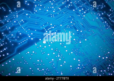 macro shot of the back side of a blue circuit board Stock Photo