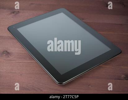 modern black tablet pc on old wood table with space for text Stock Photo