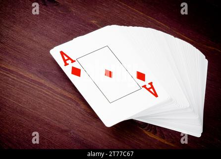 ace playing card on old wood table, concept of poker game texas Stock Photo