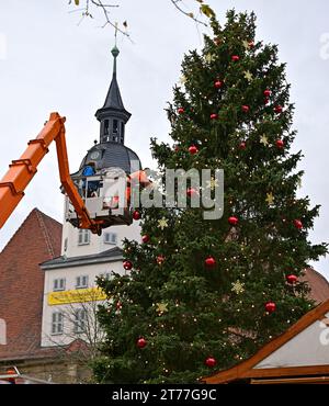 Jena, Germany. 14th Nov, 2023. The Christmas tree on Jena's market square is decorated. The 18-metre-high blue spruce is the focal point of the Jena Christmas market, which takes place from 24 November to 22 December. Credit: Martin Schutt/dpa/Alamy Live News Stock Photo