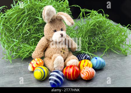Easter bunny with Easter eggs in Easter nest Stock Photo