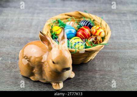 Easter bunny with Easter eggs in Easter nest Stock Photo