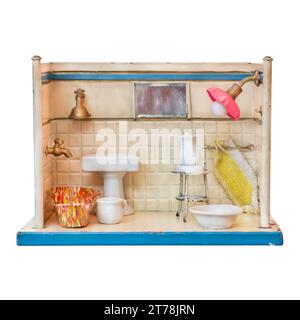 Old weathered doll house bathroom isolated on a white background Stock Photo