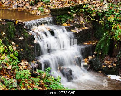 Water splashing over the weir in Mackintosh Park Knaresborough North Yorkshire England Stock Photo