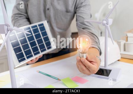 Architect working design apply renewable green energy. Stock Photo