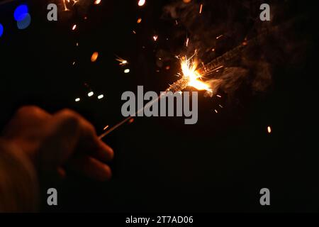 The sparkling fire cracker on the night of Diwali festival. Stock Photo
