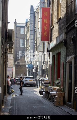 Alleyway in Soho with a Chinese vegetable shop with display outside. Stock Photo