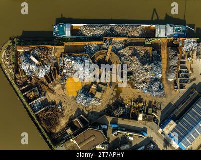 aerial view of a professional scrapyard along a canal Stock Photo
