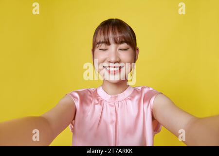 Romantic, feminine female reaching hands, want hold someone tight, embrace in her arms, close eyes Stock Photo