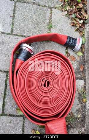 Closeup of coiled fire hose Stock Photo - Alamy