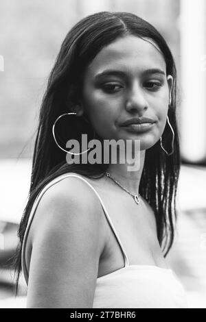 Black and white head and chest street portrait of a young South-African woman Stock Photo