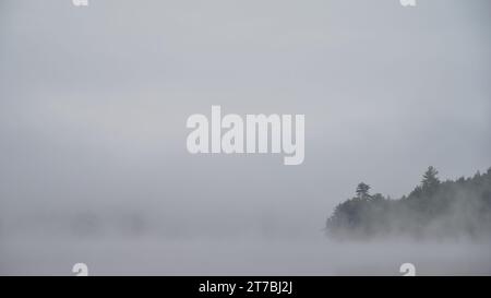 A foggy morning on Cobbossee Lake, Maine Stock Photo