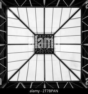 Wobbling squares -- a black and white image of a skylight made of metal and glass. Stock Photo