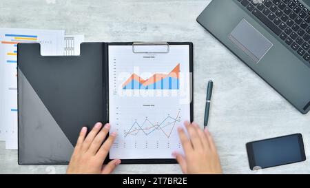 Businessman hands checking business profits. Paperwork and financial success concept. Close up Stock Photo