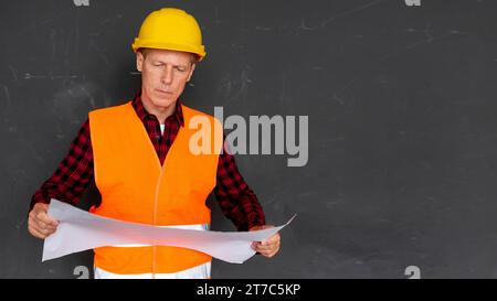 Architect checking plans with copy space Stock Photo
