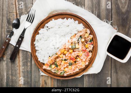 Chinese fried steamed rice wooden plate with soya sauce table Stock Photo