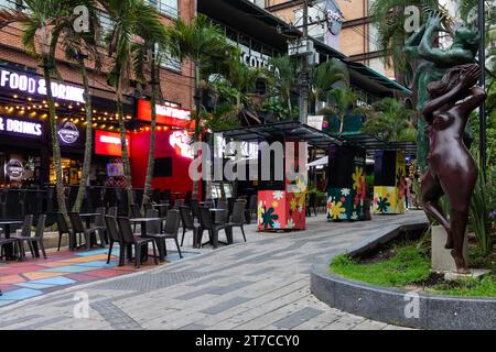 Outdoor seating, restaurant, neon lighting, night, Medellin, Colombia Stock Photo