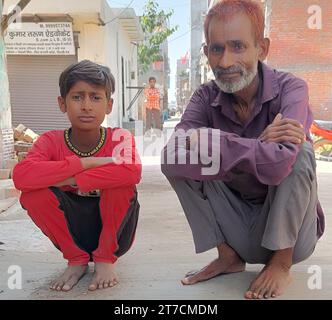 Neu Delhi, India. 02nd Oct, 2023. Sher Singh and his 14-year-old son. Sher Singh is always out of breath. He can only walk for a short time. Yet he is only about 50 years old, he doesn't know that for sure. Singh lives in the Indian capital of New Delhi and has been suffering from a lung disease since he climbed into a septic tank around three meters deep around three years ago to clear a blockage that had collected solid waste from toilets. Credit: Sunrita Sen/-/dpa/Alamy Live News Stock Photo