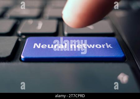 AI. Artificial Intelligence concept: Close up index finger pressing computer key with AI word and symbol. Visualization of machine learning computer t Stock Photo