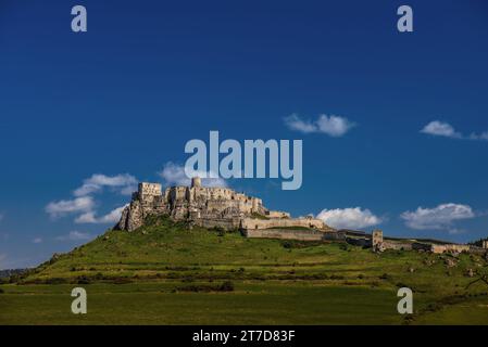 The ruins of Spis Castle (Slovak Spissky hrad, Hungarian Szepesi var, German Zipser Burg) in eastern Slovakia form one of the largest castle sites in Stock Photo