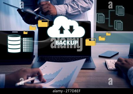 Man uses computers. Online backup technology, data storage on a laptop, digital cloud, database information Cloud storage technology Stock Photo