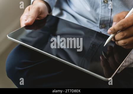 man hands using tablet Working, connecting wifi, and chatting in social networks Stock Photo