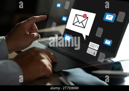 man typing  search on laptop  Mail Communication Connection message to mailing contacts phone Global Letters Concept Stock Photo