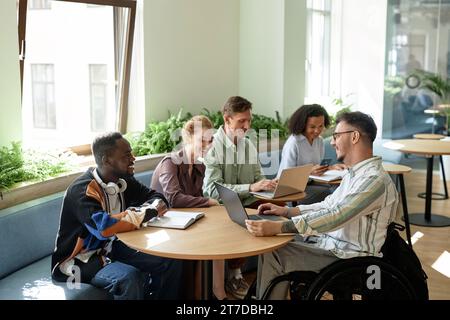 Group of business people having meeting in office, they using computers and discussing working moments Stock Photo