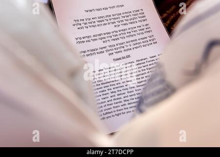 Text in Hebrew and English of the prayer for the soldiers in the Israel Defense Forces recited in synagogue during daily prayer services. Stock Photo